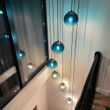 Lampă-suspendată-Art-Deco-din-alamă-cu-sticlă-albastră-7-lumini---Pallon